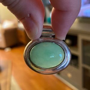 Sterling silver and jade pendant.